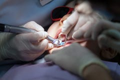 Little Girl on Dentist Chair, Kid is taking Dental Procedure royalty free stock photo Little Girl on Dentist Chair, Kid is taking Dental Procedure royalty free stock photo