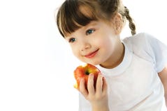 Little girl eating an apple stock photo Little girl eating an apple stock photo