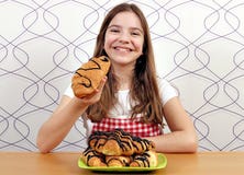 Little girl eats croissant with chocolate Royalty Free Stock Images Little girl eats croissant with chocolate Royalty Free Stock Images
