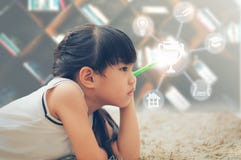 Little Girl holds the pen in her hand and thinks . Education and Royalty Free Stock Photos Little Girl holds the pen in her hand and thinks . Education and Royalty Free Stock Photos