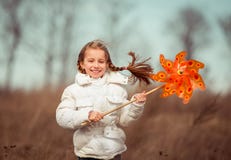 Little Girl Holds Windmill In Hand Royalty Free Stock Photography
