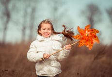 Little Girl Holds Windmill In Hand Stock Photography