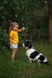Little girl and mongrel dog outdoors stock photos Little girl and mongrel dog outdoors stock photos