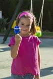 Little girl playing with a spinning top Stock Images Little girl playing with a spinning top Stock Images