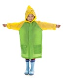 Little girl with raincoat and rubber boots