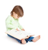 Little Girl Reading A Book Stock Photography