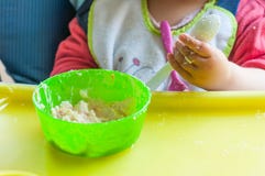 Little girl's eating mash stock image Little girl's eating mash stock image