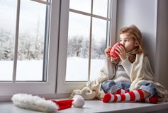 Little Girl Sitting By The Window Stock Photos Little Girl Sitting By The Window Stock Photos