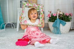 The little girl is sitting and smiling royalty free stock photography The little girl is sitting and smiling royalty free stock photography