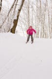 Little Girl Sliding Down Hill On Ski Royalty Free Stock Photos