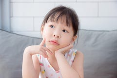 Little Girl Thinking And Looking Up Stock Images