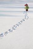 Little Girl Walking On Snow Royalty Free Stock Photography Little Girl Walking On Snow Royalty Free Stock Photography