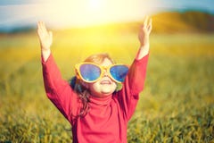 Little Girl Wearing Big Sunglasses Looking At The Sun Royalty Free Stock Photography