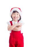 Little girl wearing santa claus red dress smiling. Little asian girl wearing santa claus red dress standing and smiling over white background Stock Photography Little girl wearing santa claus red dress smiling. Little asian girl wearing santa claus red dress standing and smiling over white background Stock Photography