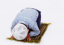 Little muslim boy is praying stock photos Little muslim boy is praying stock photos