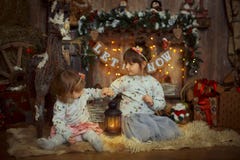 Little sisters at Christmas Eve Stock Photography Little sisters at Christmas Eve Stock Photography