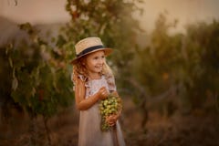 Little girl in the apple garden