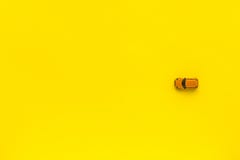 Little Yellow toy car on a yellow background. Free space for text stock photography Little Yellow toy car on a yellow background. Free space for text stock photography