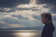 Little girl on the shore of Lake Ohrid royalty free stock image Little girl on the shore of Lake Ohrid royalty free stock image