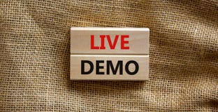 Live demo symbol. Concept words `live demo` on wooden blocks on a beautiful canvas background. Copy space. Business and live dem