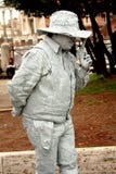 A living statue of an Italian ganster, asking for handout and keeping revolvers stock images A living statue of an Italian ganster, asking for handout and keeping revolvers stock images