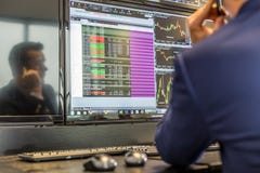 Stock Broker Trading Online Talking On Mobile Phone Editorial
