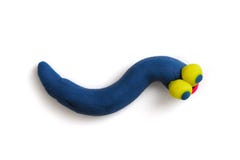 Ljus blå plasticine avmaskar med stora gula ögon som isoleras på den vita bakgrunden royaltyfri fotografi Ljus blå plasticine avmaskar med stora gula ögon som isoleras på den vita bakgrunden royaltyfri fotografi