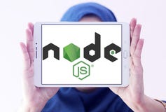 Node.js logo. Logo of Node.js on samsung tablet holded by arab muslim woman. Node.js is an open-source, cross-platform JavaScript run-time environment for royalty free stock photo