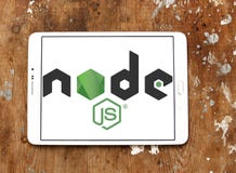 Node.js logo. Logo of Node.js on samsung tablet on wooden background. Node.js is an open-source, cross-platform JavaScript run-time environment for executing stock photos