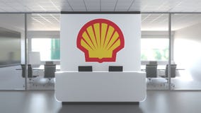 ROYAL DUTCH SHELL PLC logo in modern office and a meeting room, editorial conceptual 3D animation