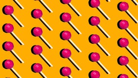 Lollipop candy on yellow background animation, pop art style minimal design