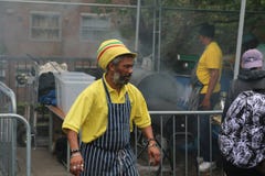 Notting Hill Carnival Jamaican chef cooking jerk chicken in food street market