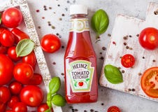 LONDON, UK - SEPTEMBER 13, 2018: Heinz Ketchup With Fresh Raw Tomatoes In Box On Stone Kitchen Background. Royalty Free Stock Photo LONDON, UK - SEPTEMBER 13, 2018: Heinz Ketchup With Fresh Raw Tomatoes In Box On Stone Kitchen Background. Royalty Free Stock Photo