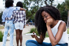 Lonely african american woman waiting for message Royalty Free Stock Photography Lonely african american woman waiting for message Royalty Free Stock Photography
