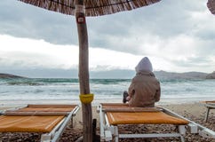 Lonely child in stormy weather at night in the beach royalty free stock photography Lonely child in stormy weather at night in the beach royalty free stock photography