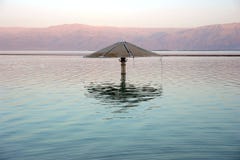 Lonely Sunshade In The Middle Of The Dead Sea Stock Photos