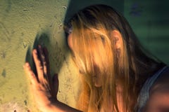 Lonely woman in despair leaning on the wall Royalty Free Stock Image Lonely woman in despair leaning on the wall Royalty Free Stock Image