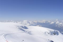 Long alpine skiing track n the very top of Swiss Alps stock photo Long alpine skiing track n the very top of Swiss Alps stock photo