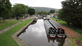 Long boats on canal by Pontcysyllte Aqueduct Llangollen Wales UK stock video Long boats on canal by Pontcysyllte Aqueduct Llangollen Wales UK stock video