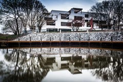 Long exposure of a building along the shore of Lake Kittamaqundi, in Columbia, Maryland. stock photos Long exposure of a building along the shore of Lake Kittamaqundi, in Columbia, Maryland. stock photos