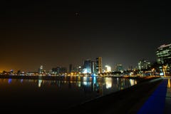 Long exposure night wide angle view of Marginal de Luanda with full moon and Mars during total lunar eclipse stock photo Long exposure night wide angle view of Marginal de Luanda with full moon and Mars during total lunar eclipse stock photo