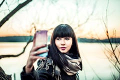 Long hair brunette gir making selfie photo royalty free stock images Long hair brunette gir making selfie photo royalty free stock images