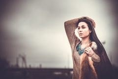 Long hair brunette girl outdoor with old industrial view behind, grain effect stock photography Long hair brunette girl outdoor with old industrial view behind, grain effect stock photography