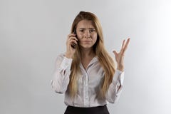 Long-haired businesswoman in formal clothes talking on the phone royalty free stock photo Long-haired businesswoman in formal clothes talking on the phone royalty free stock photo
