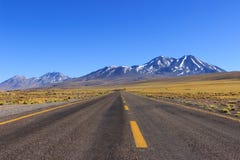 Long road with yellow lines and Mountains stock images Long road with yellow lines and Mountains stock images