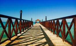 Long Wooden Dock With Fence, Stretching Into The Sea Royalty Free Stock Image Long Wooden Dock With Fence, Stretching Into The Sea Royalty Free Stock Image