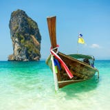 Longtail boat at the tropical beach stock photo Longtail boat at the tropical beach stock photo
