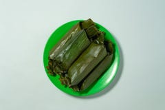 Lontong is a traditional food that wrapped in banana leaves