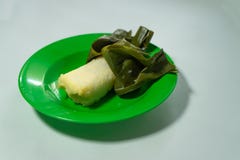 Lontong is a traditional food that wrapped in banana leaves