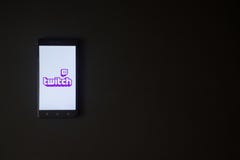Twitch logo on smartphone screen on black background. Royalty Free Stock Photography Twitch logo on smartphone screen on black background. Royalty Free Stock Photography
